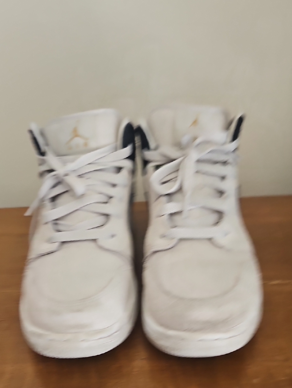 Jordan White High-Top Sneakers with Gold Logo